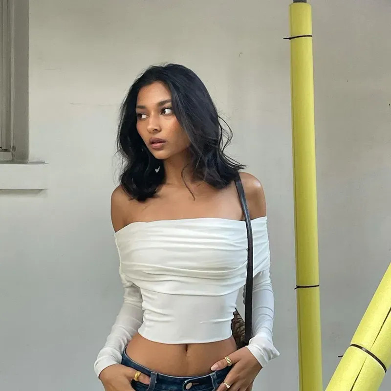 White Draped Off-the-Shoulder Top with Denim Jeans and Hoop Earrings — Off the Shoulder Tops