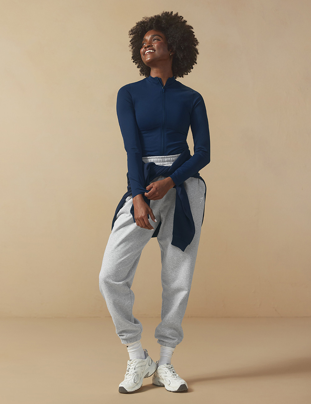 Navy Zip-Up Top and Grey Sweatpants with Layered Sweatshirt — Gymshark Outfits