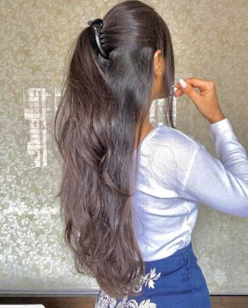 Long Wavy Dark Brown Ponytail — The Back View Of A Woman With Long Long Wavy Dark Brown Ponytail — The Back View Of A Woman With Long — Banana Clip Hairstyles