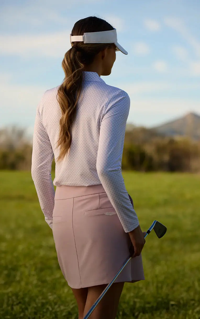 White Patterned Top and Pink Skort for a Chic Golf Ensemble White Patterned Top and Pink Skort for a Chic Golf Ensemble — Golf Outfits
