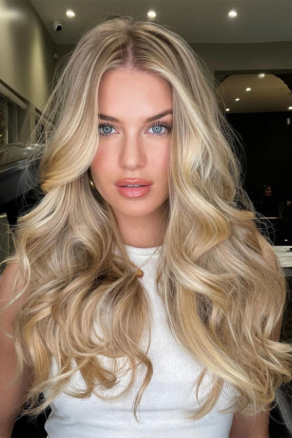 Butter Blonde Balayage With Curtain Bangs