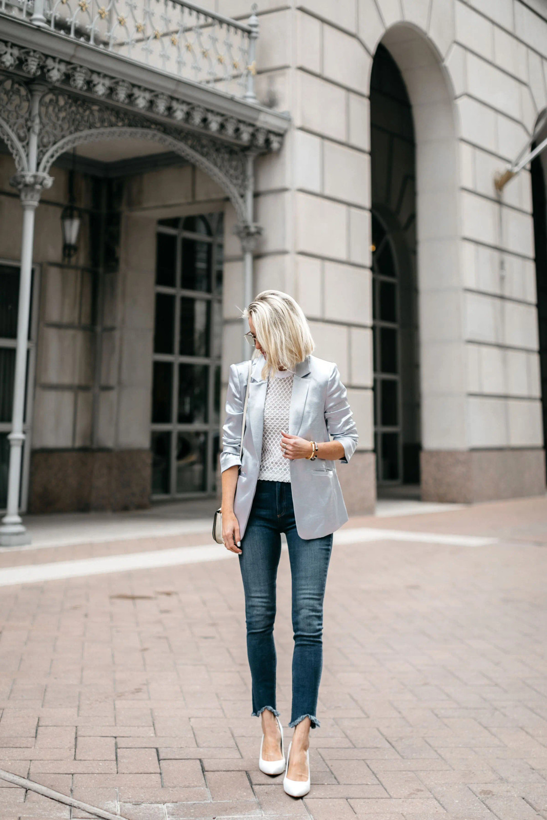 Silver Metallic Blazer Layered Over a White Textured Top and Slim Jeans Silver Metallic Blazer Layered Over a White Textured Top and Slim Jeans — Teacher Conference Outfits