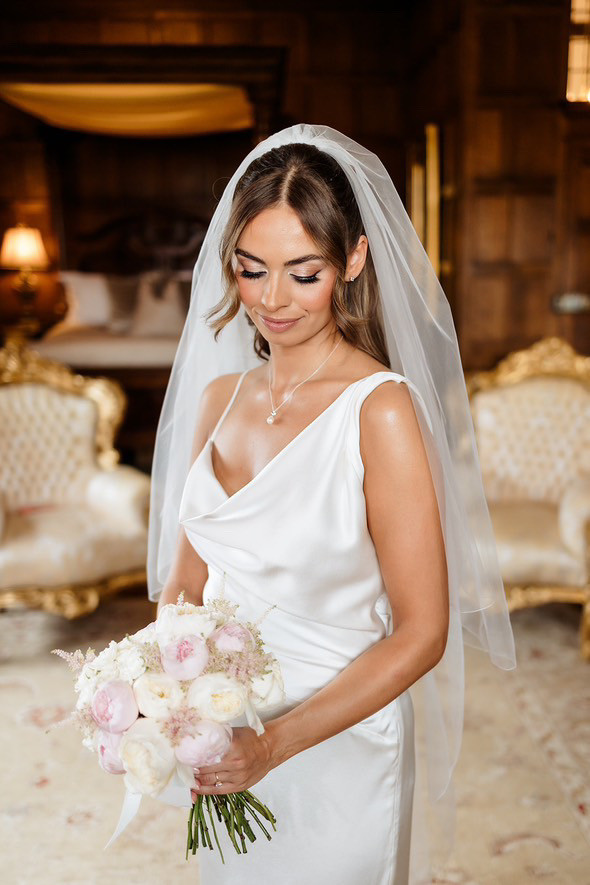 Medium Brown With Subtle Highlights Half-Up Loose Waves with Curtain Bangs Medium Brown With Subtle Highlights Half-Up Loose Waves with Curtain Bangs — Wedding Hairstyles with Veil