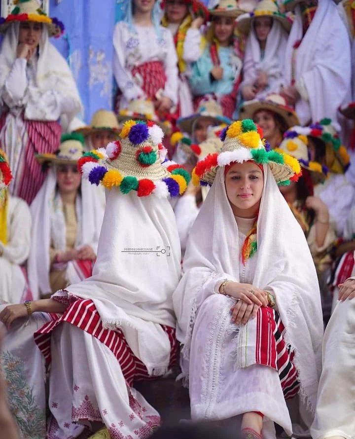 Traditional Moroccan Attire with Pom-Pom Straw Hats Traditional Moroccan Attire with Pom-Pom Straw Hats — Morocco Outfits