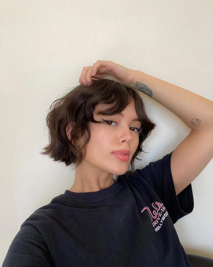 Textured Choppy Bob With Curtain Bangs — Hairstyles for Growing Out a Bob