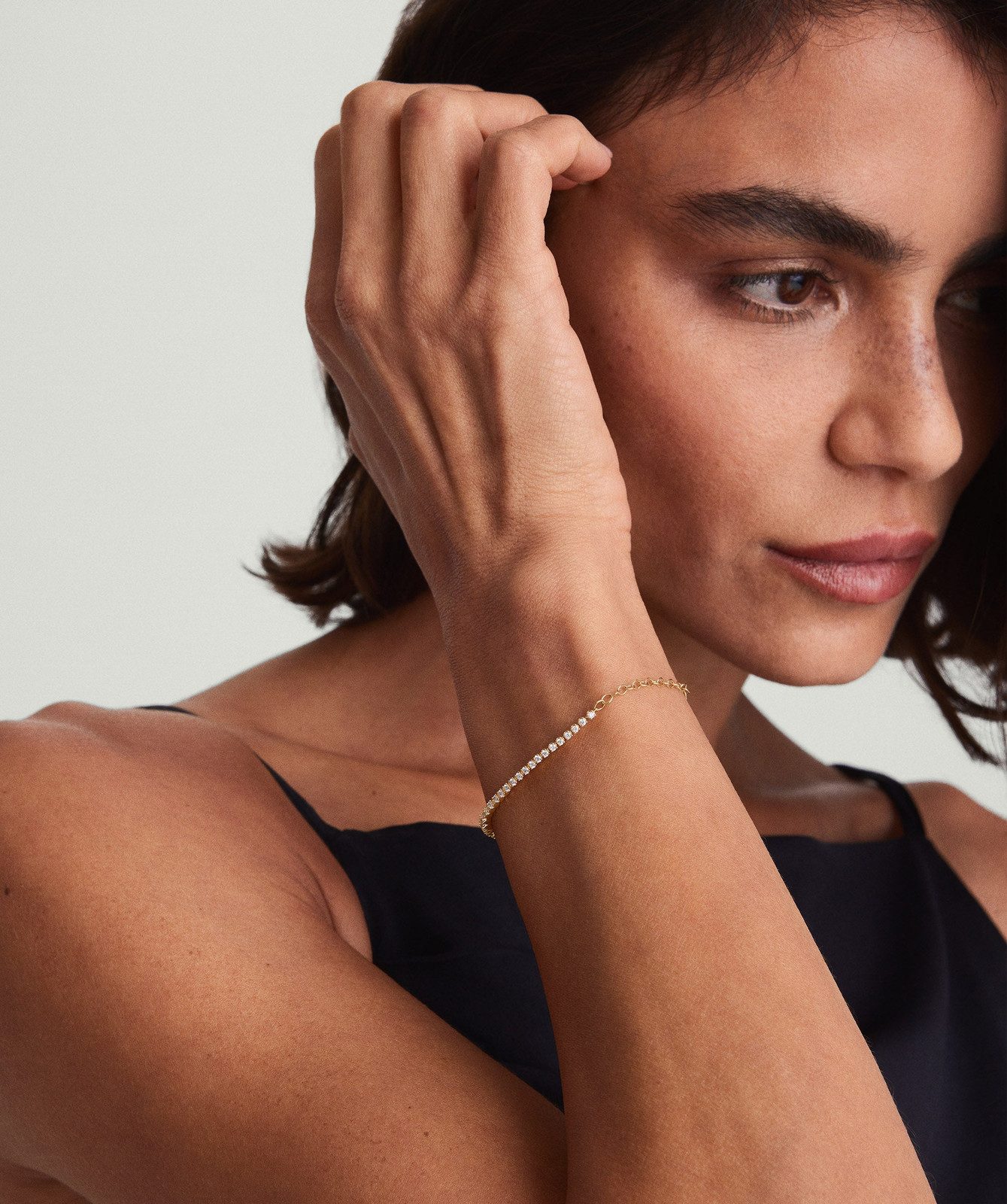 Delicate Gold Tennis Bracelet with Black Camisole Delicate Gold Tennis Bracelet with Black Camisole — Tennis Bracelets