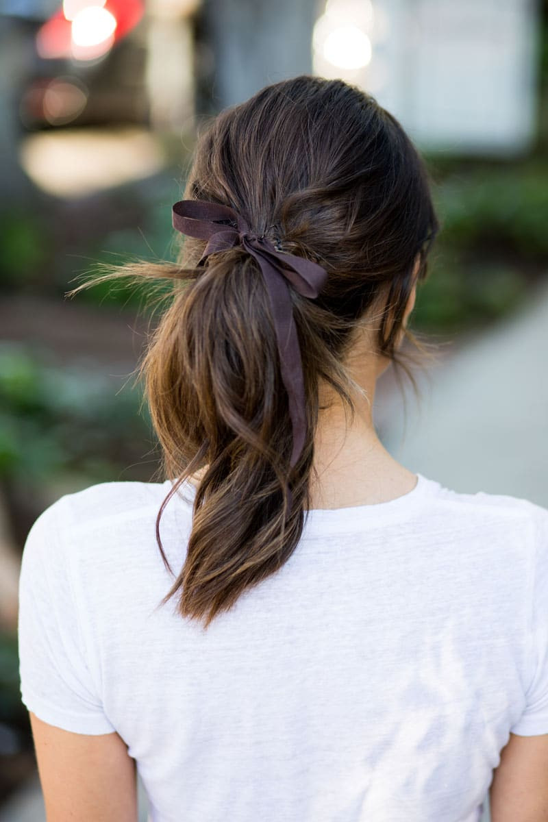 Mid-Back Thick Blonde Ponytail With Black Satin Bow Mid-Back Thick Blonde Ponytail With Black Satin Bow — Ribbon Hairstyles