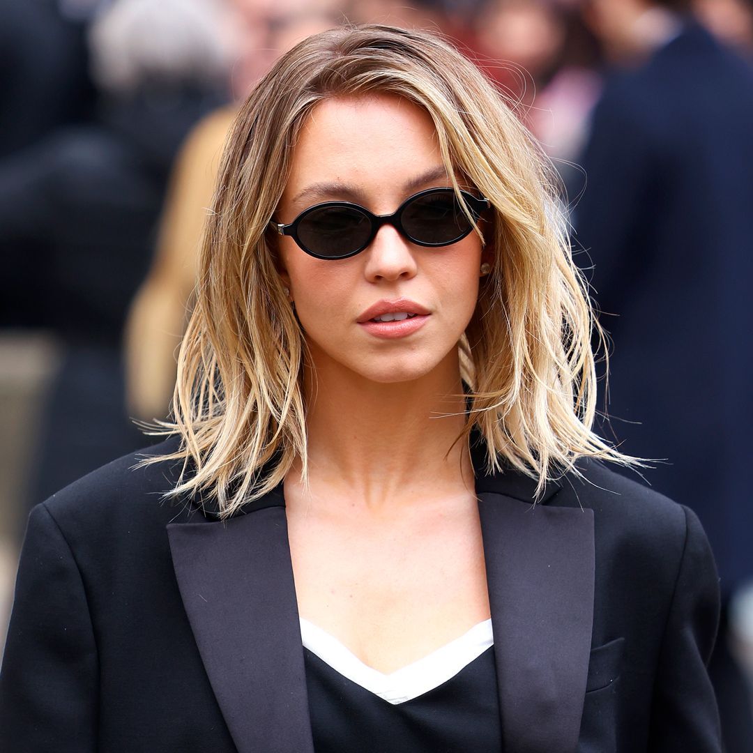 Oval Black Sunglasses with Blazer for Evening — Sunglasses for Heart Shaped Face