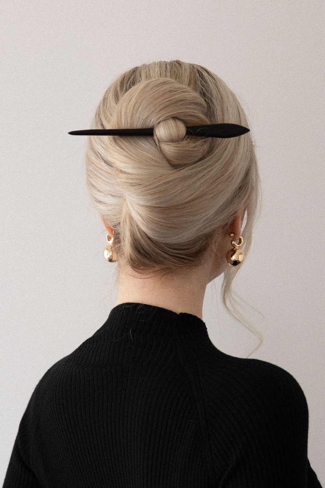 Sleek Blonde Updo With Black Stick — Hair Stick Hairstyles