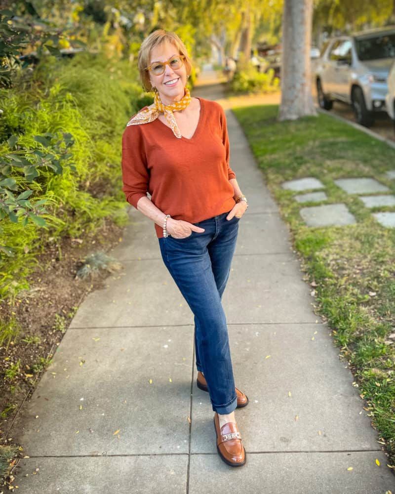 Rust V-Neck Sweater Knit Sweater and Straight-Leg Jeans with Printed Scarf and Penny Loafers — Penny Loafers Outfits