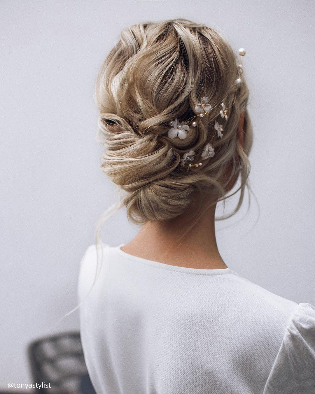 Textured Low Updo With Floral Pins Textured Low Updo With Floral Pins — Wedding Hairstyles for Thin Hair