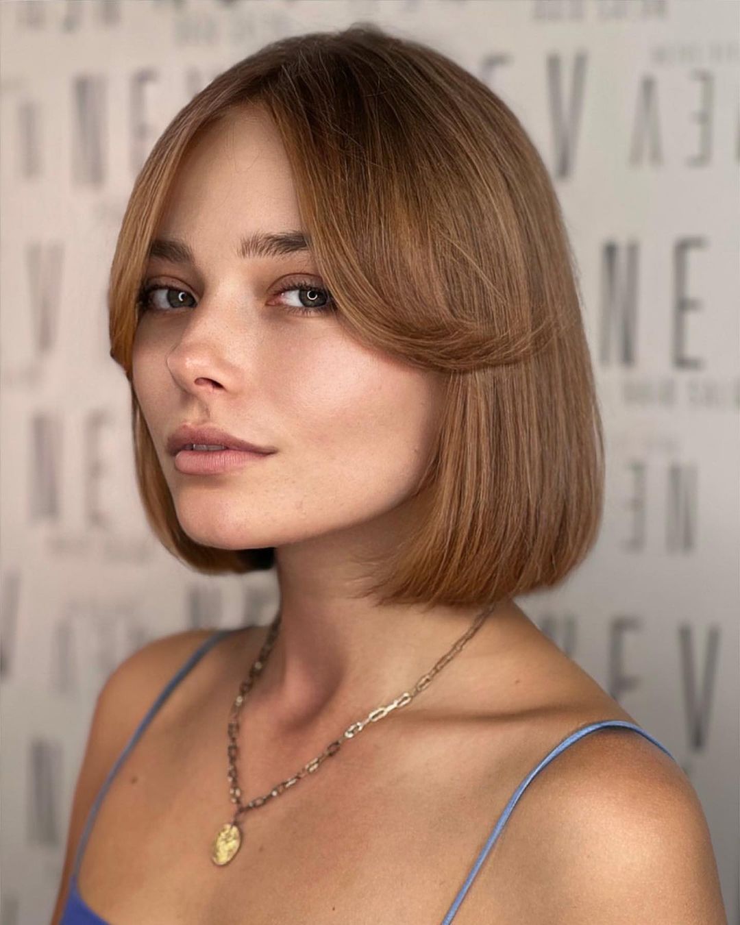 Side View Sleek Dark Brown Bob With Curtain Bangs Side View Sleek Dark Brown Bob With Curtain Bangs