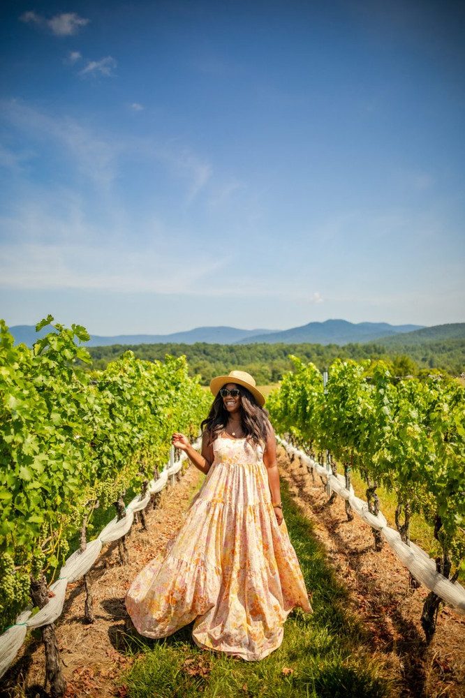Vibrant Floral Maxi Dress with Straw Hat for Sunny Wine Tastings Vibrant Floral Maxi Dress with Straw Hat for Sunny Wine Tastings — Wine Tasting Outfits