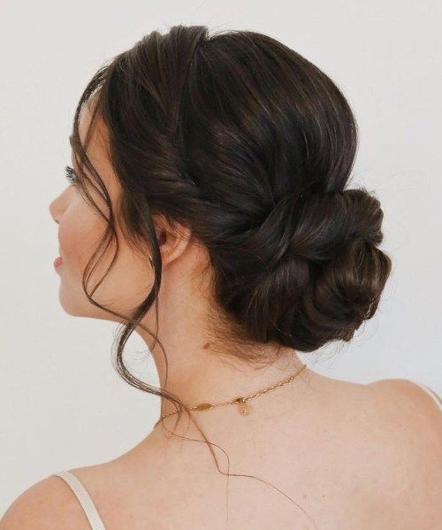 Side Swept Low Twisted Bun With Tendrils Side Swept Low Twisted Bun With Tendrils — Wedding Guest Hairstyles
