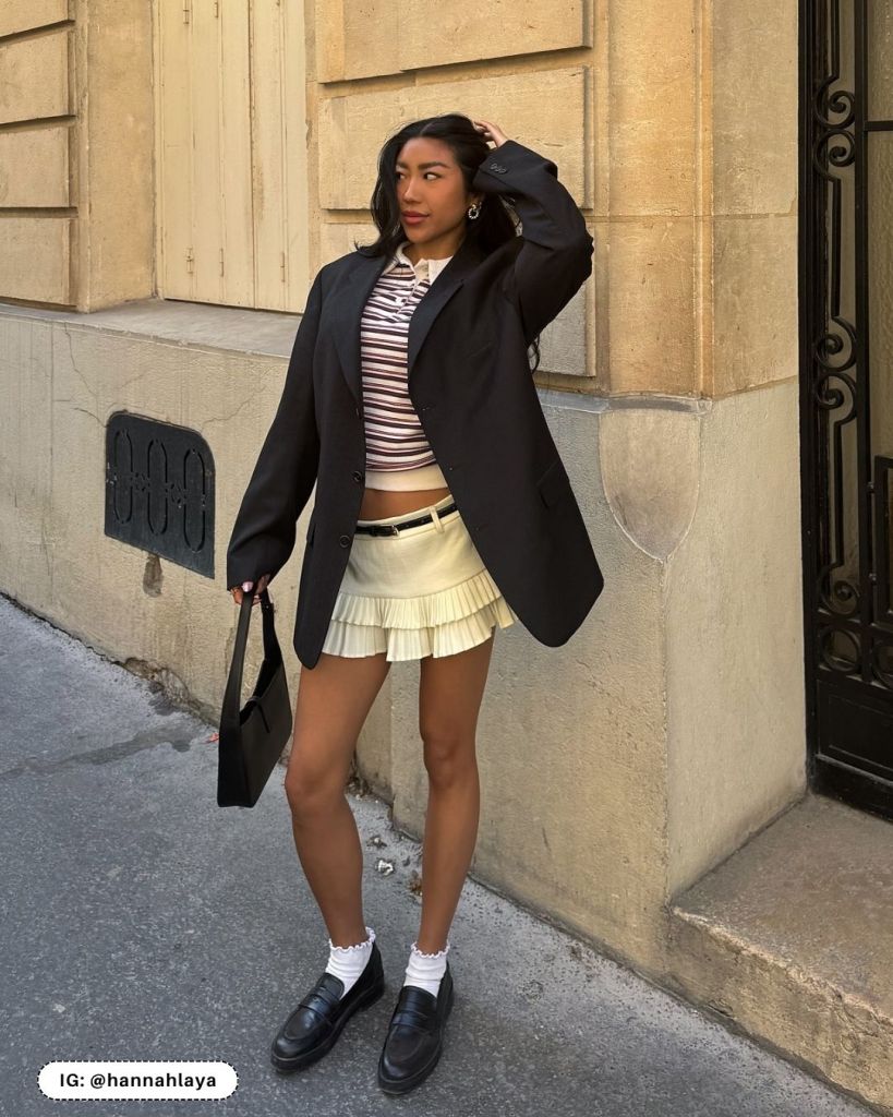 Black Loafers with White Socks, a Ruffled Mini Skirt, and Oversized Blazer — Loafer Outfits
