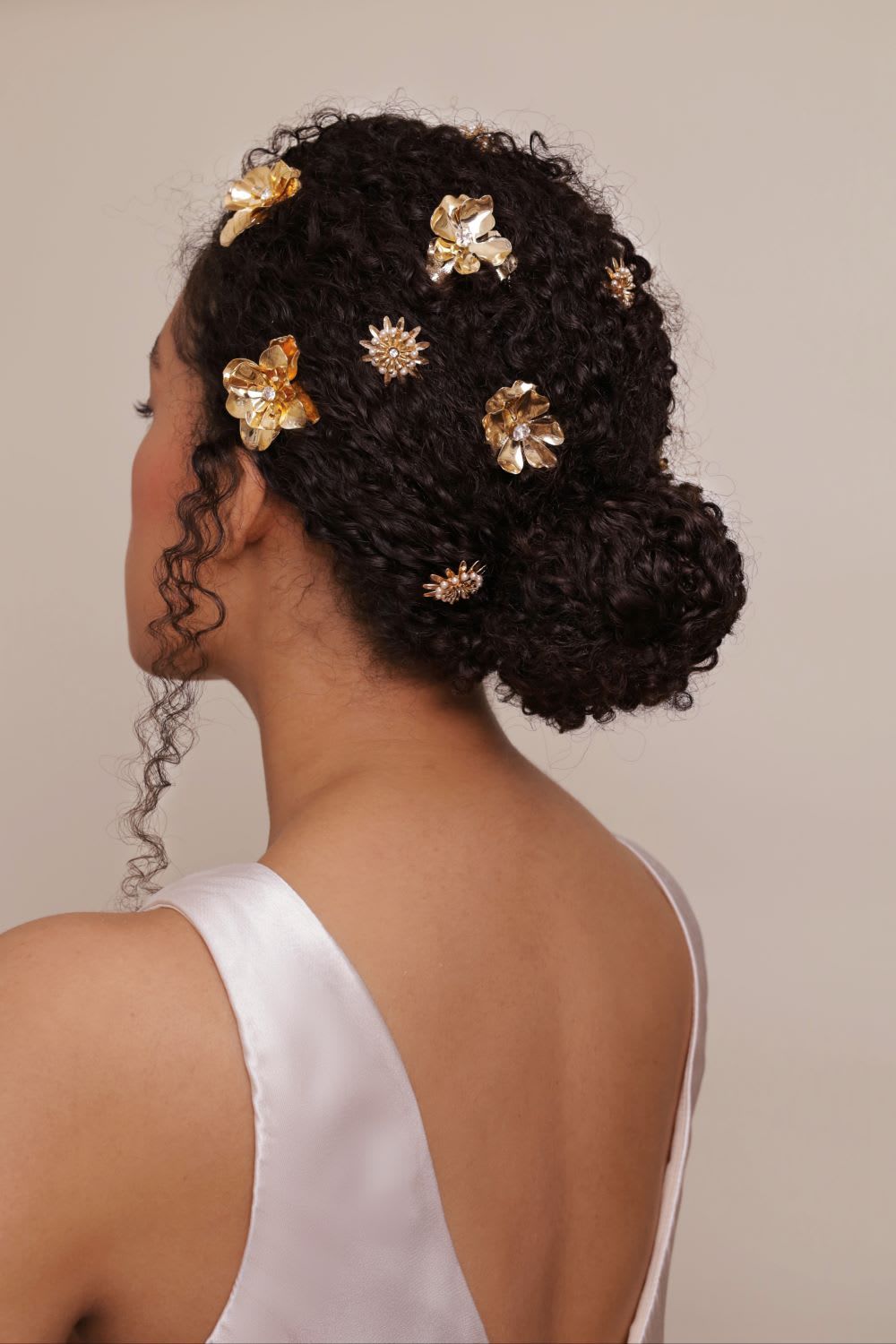 Updo With Braided Accents and Pearls Updo With Braided Accents and Pearls — Wedding Hairstyles for Curly Hair