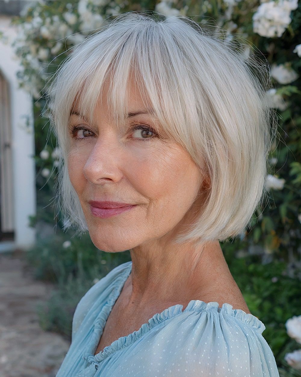 Ash Blonde Bob With Blunt Bangs Ash Blonde Bob With Blunt Bangs — Hair Color for Women Over 60