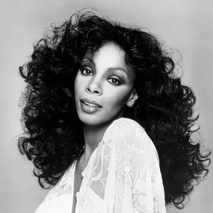 Mid-Back Dark Brown Defined Curls — 80s Hairstyles