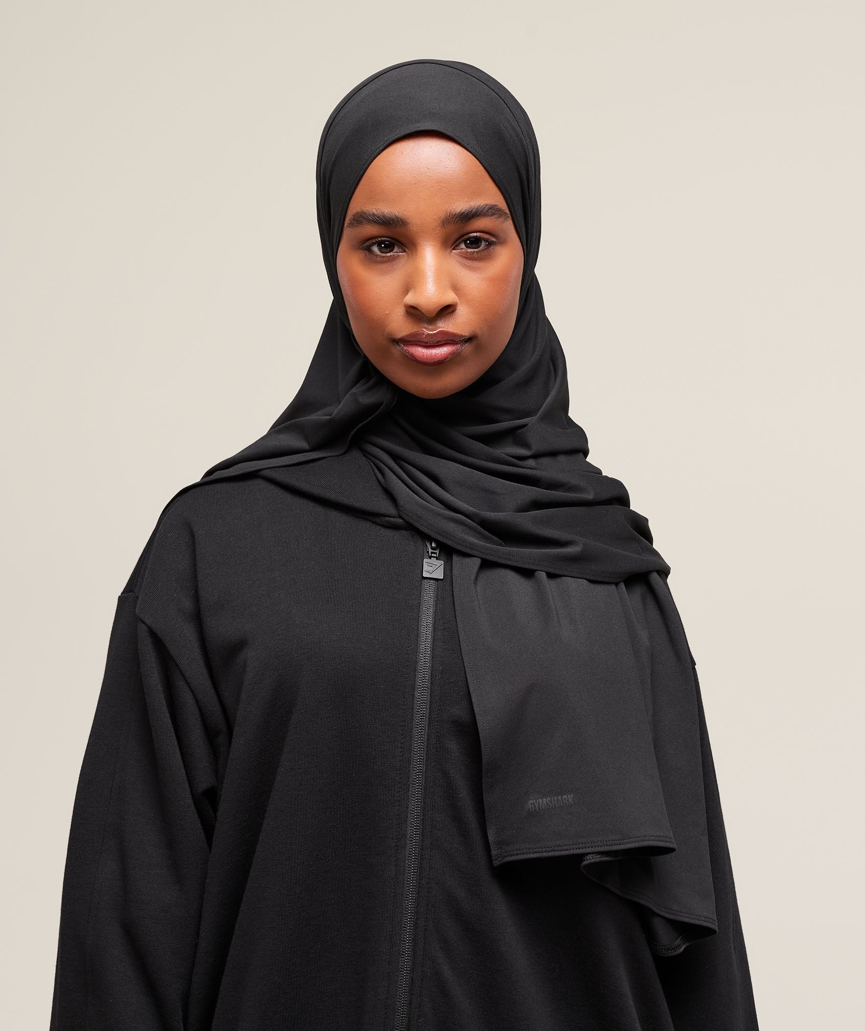 Monochromatic Black Zip-Up for a Sleek Work Look — Hijab Work Outfits