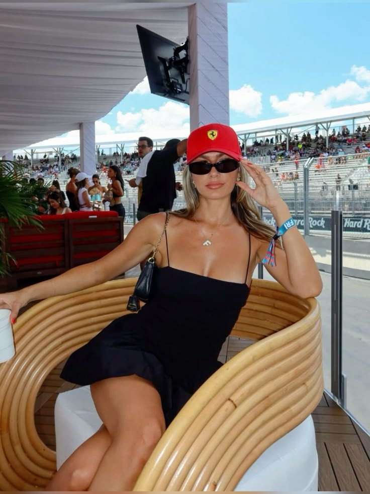 Sleek Black Mini Dress with Ferrari Cap for Racing Glamour F1 Race Outfits