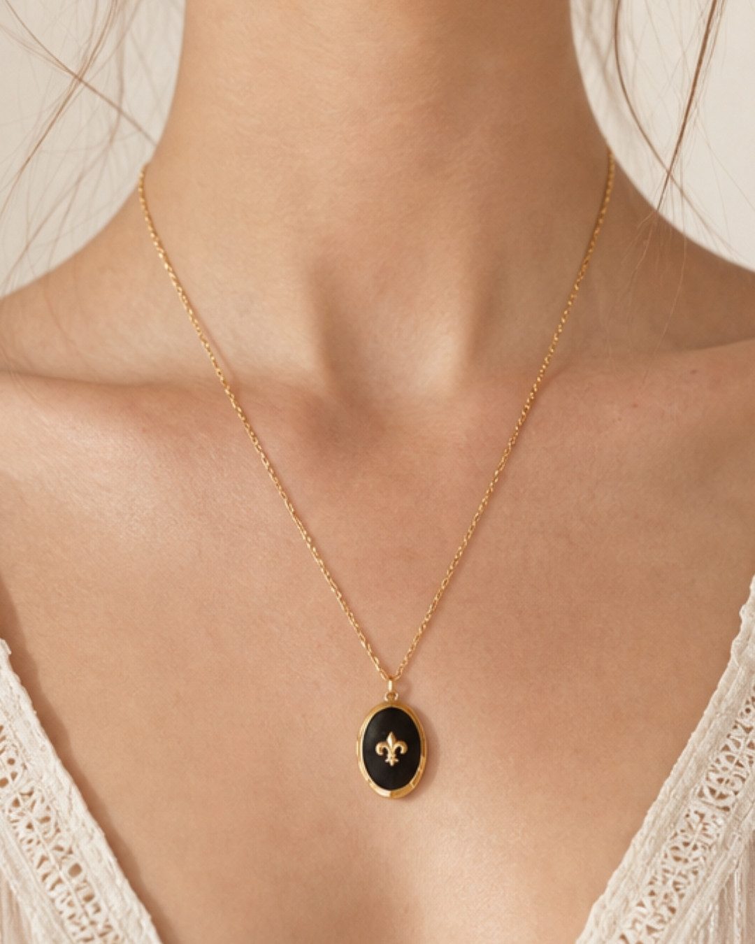 Black Oval Locket with Fleur-de-lis Emblem — Locket Necklaces