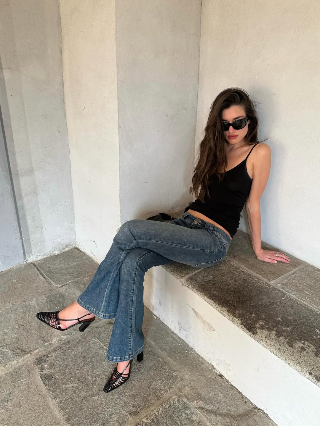 Black Camisole and Flared Jeans for a Sleek Silhouette — Low Rise Jeans Outfits