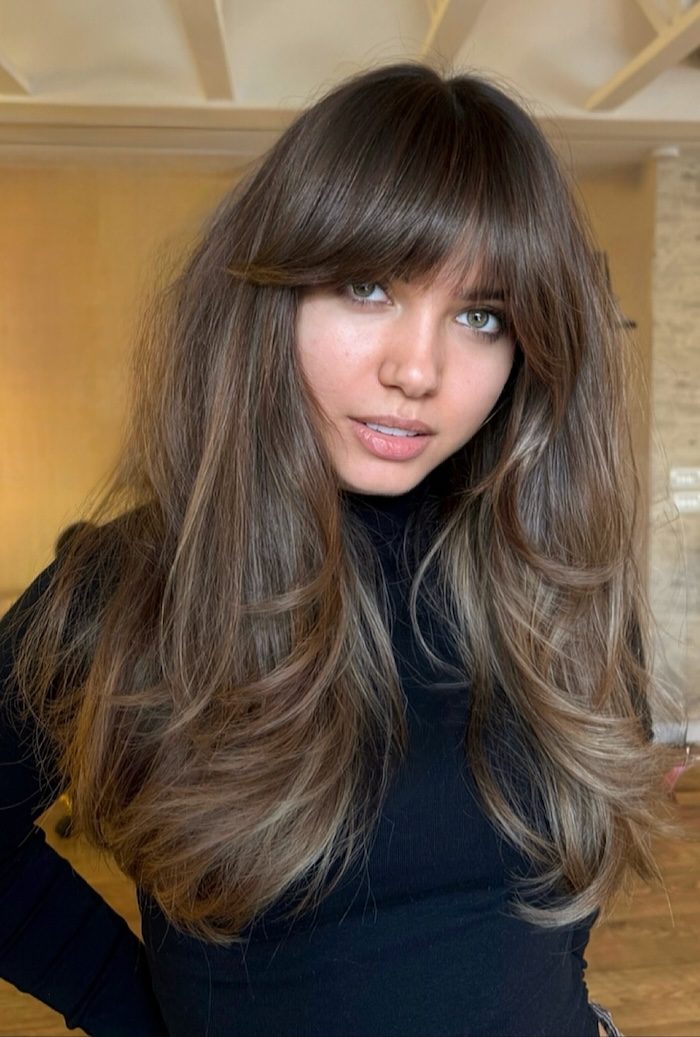 50 Long Fringe Hairstyles: Feathered Wispy Fringe with Ash Brunette Layers