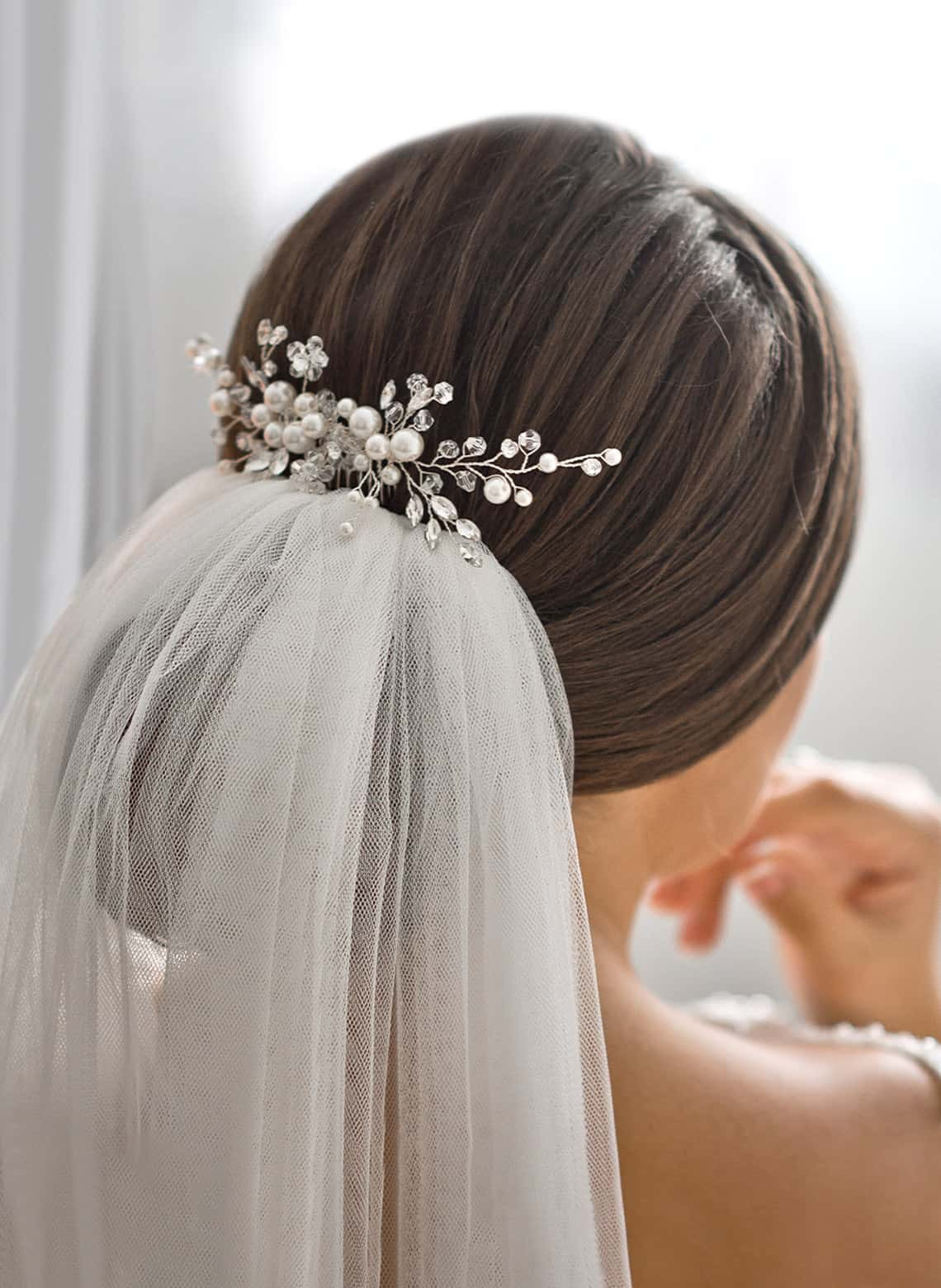 Low Intricate Bun with Sparkling Accessory Low Intricate Bun with Sparkling Accessory — Wedding Hairstyles with Veil