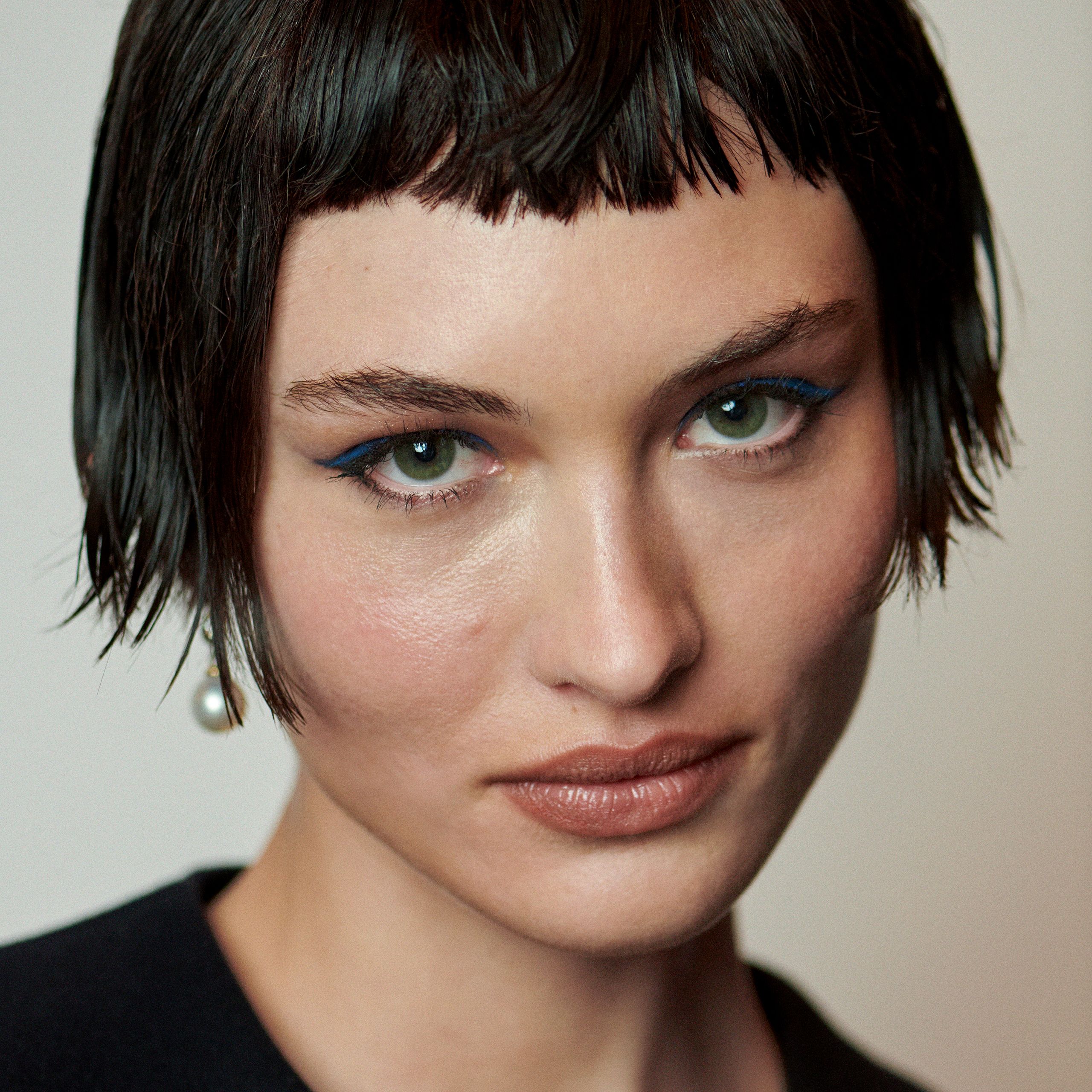 Choppy Micro-Bangs with a Black Jacket and Blue Eyeliner — Short Bangs