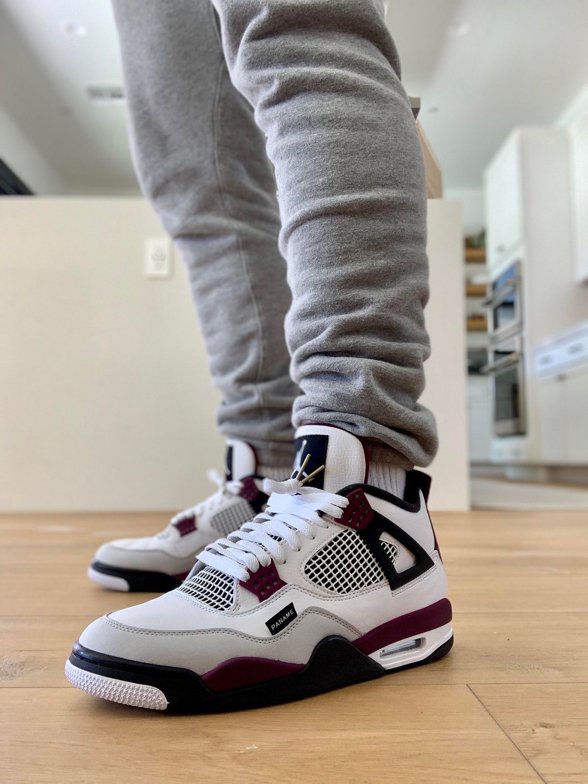 Color Blocked Comfort: White and Burgundy Jordan 4s with Grey Sweatpants Color Blocked Comfort: White and Burgundy Jordan 4s with Grey Sweatpants — Jordan 4 Outfits