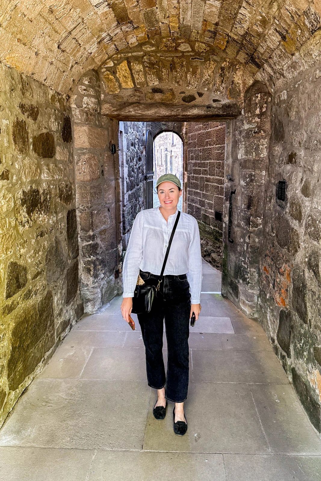 Simple White Shirt and Black Jeans with Olive Cap — Scotland Outfits