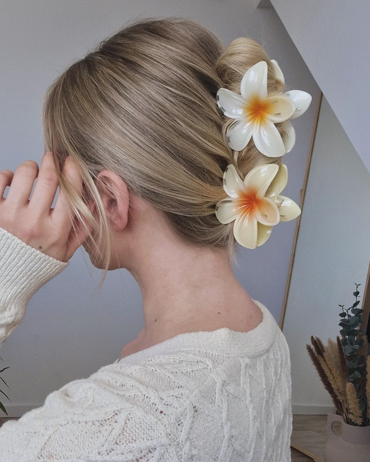 Blonde Low Bun With Floral Accents — Claw Clip Hairstyles