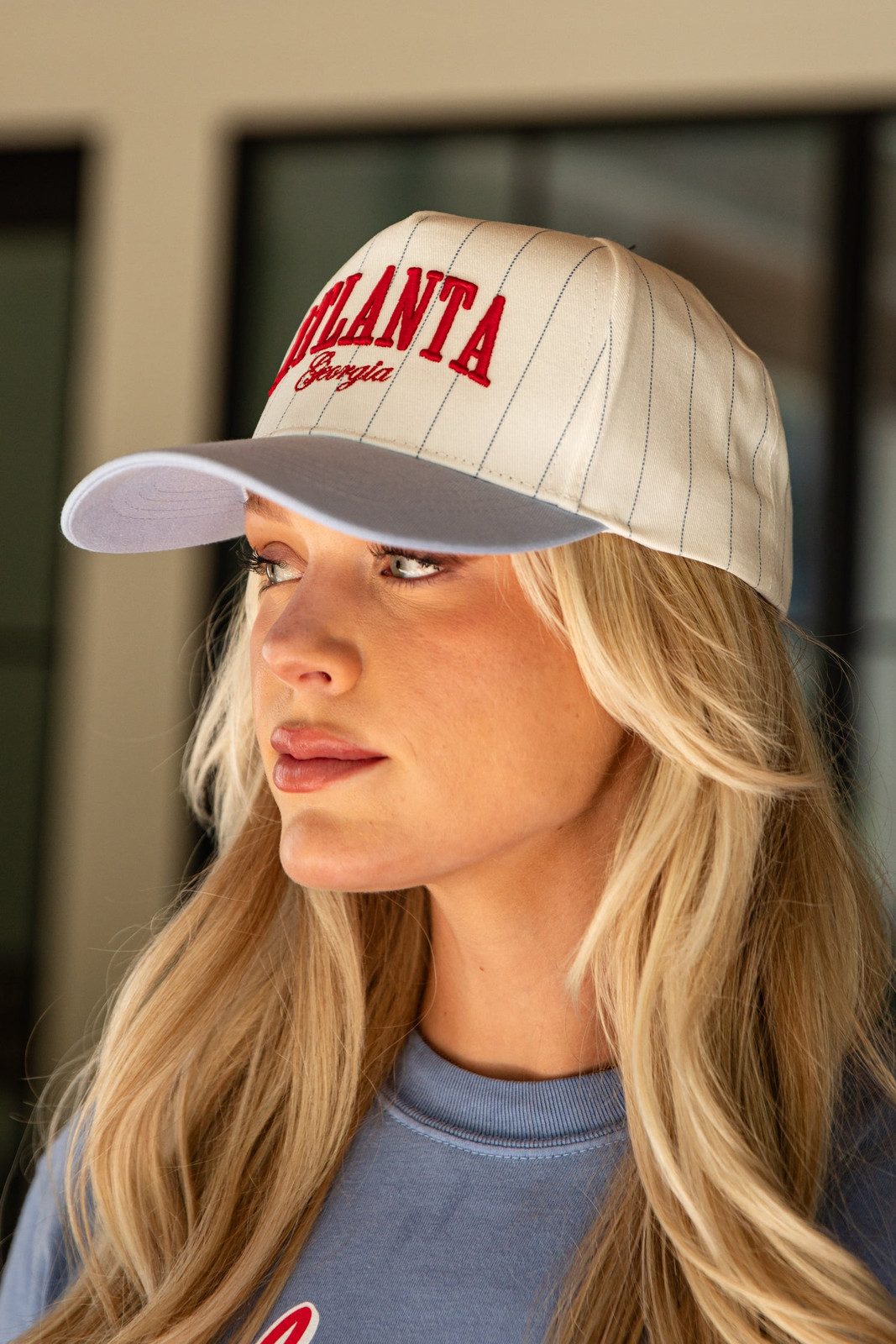 City-Themed Trucker Hat with Light Blue Sweatshirt City-Themed Trucker Hat with Light Blue Sweatshirt — Trucker Hat Outfits