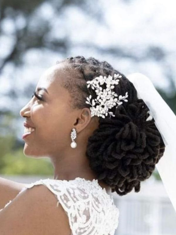 Textured Low Bun With Floral Accent Textured Low Bun With Floral Accent — Loc Styles for Wedding