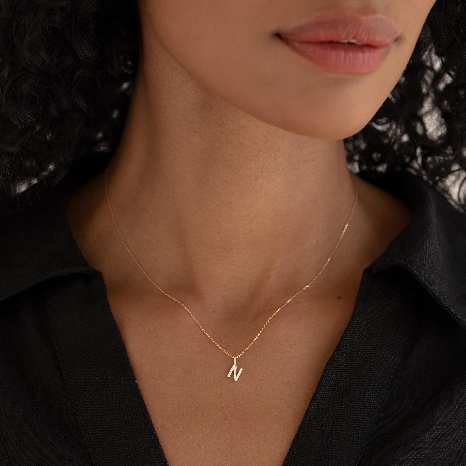 Minimalist Initial 'N' Pendant on Black Collared Shirt Minimalist Initial 'N' Pendant on Black Collared Shirt — Initial Necklaces