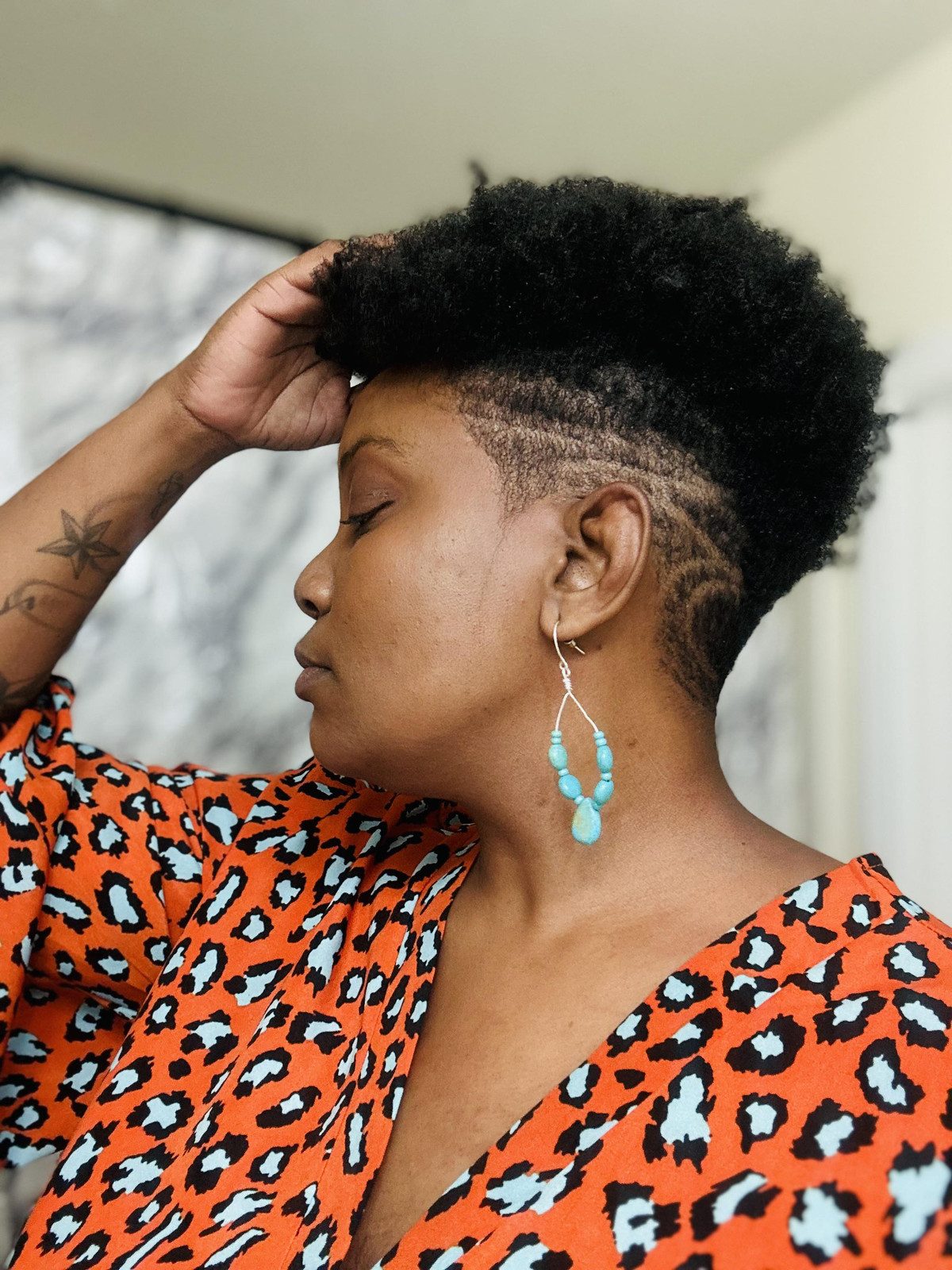 Textured Afro with Intricate Side Design — Tapered Cut for Black Women