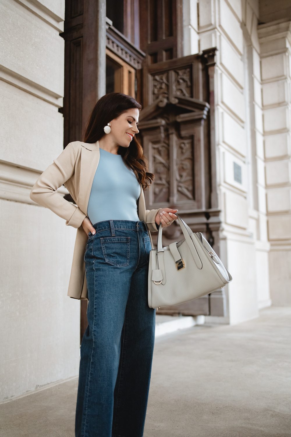 Dark Wash Wide Leg Jeans with a Beige Blazer and Statement Earrings