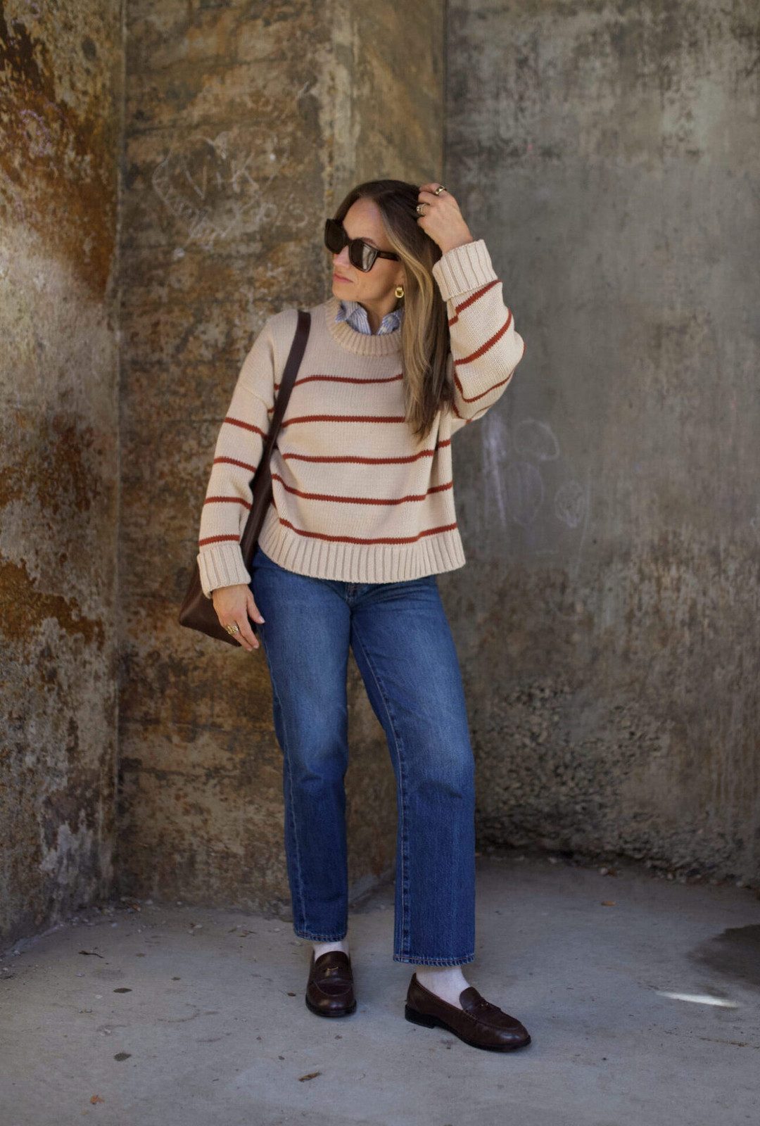 Comfortable Layers: Dark Brown Loafers with Straight Jeans and Striped Sweater — Loafers with Jeans Outfits