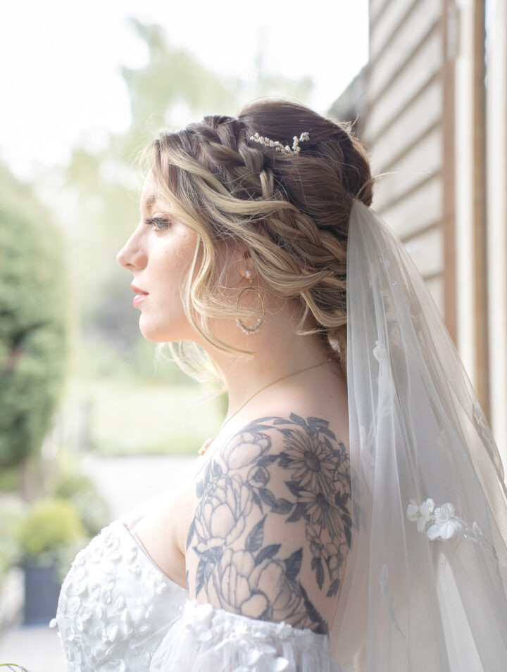 Braided Updo with Side-Swept Bangs Braided Updo with Side-Swept Bangs — Wedding Hairstyles with Veil