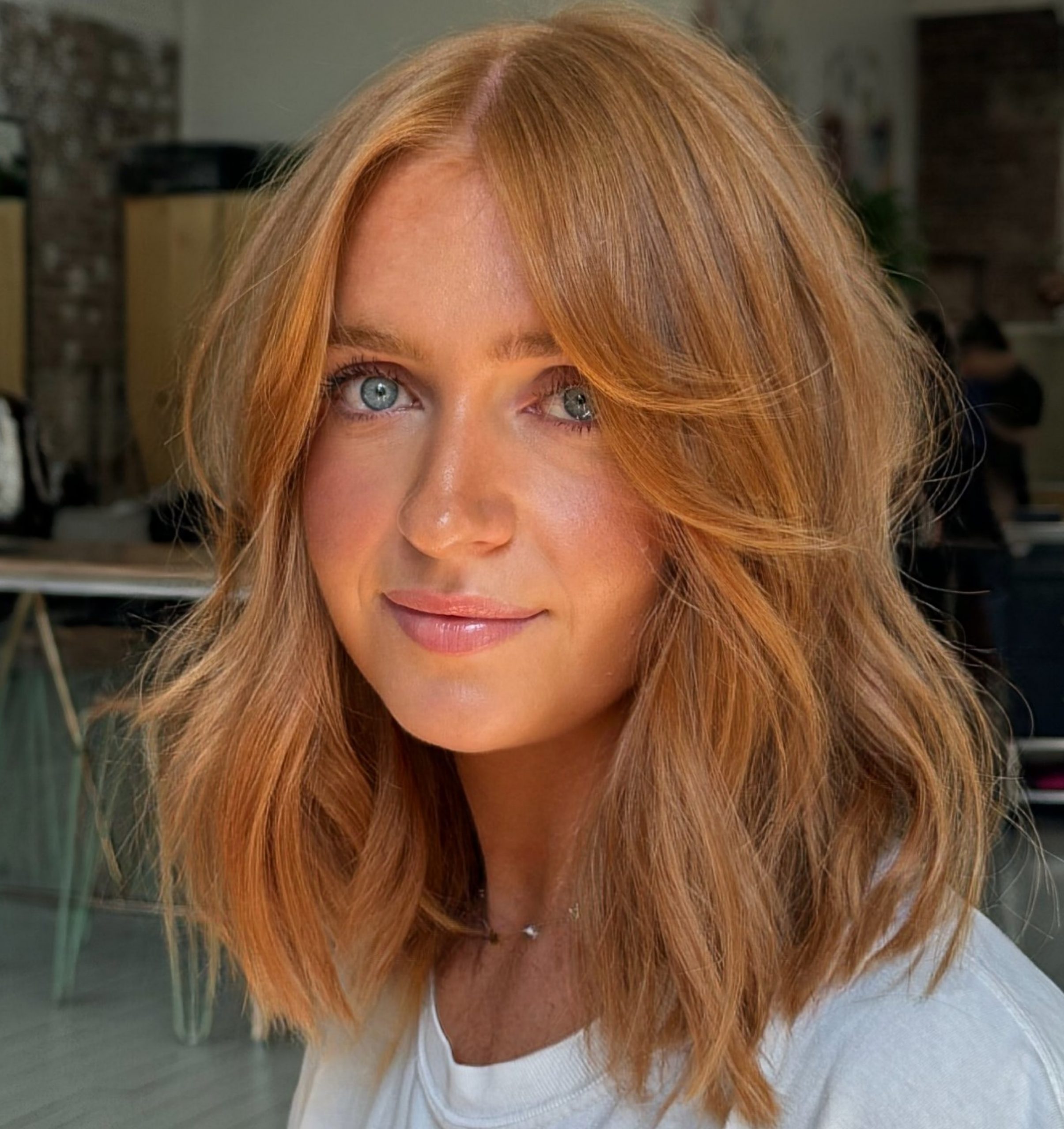 Copper Red Waves With Wispy Bangs — Medium Hair with Bangs
