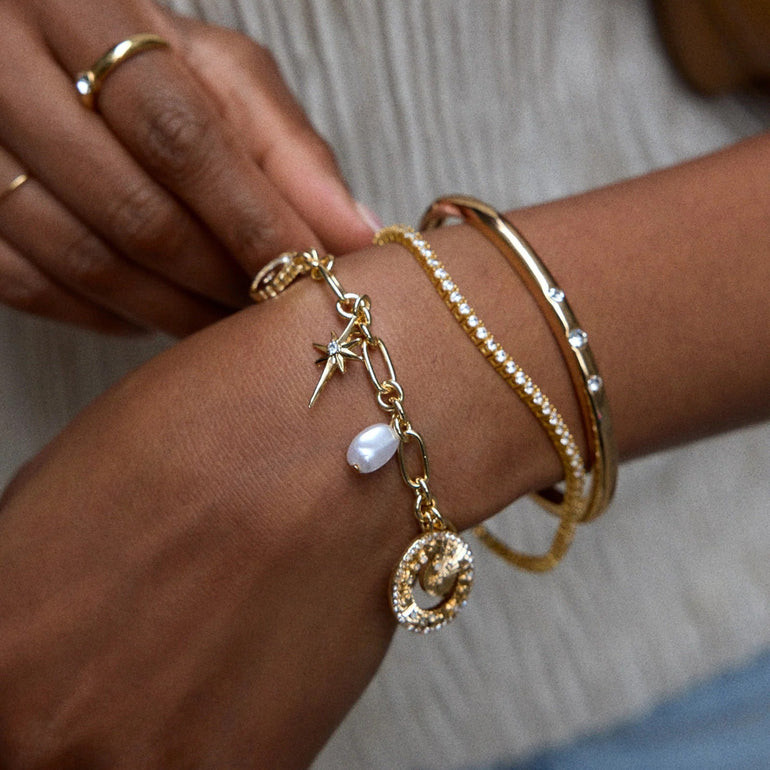 Celestial Charm Bracelet Layered with a Pavé Bangle Celestial Charm Bracelet Layered with a Pavé Bangle — Charm Bracelets