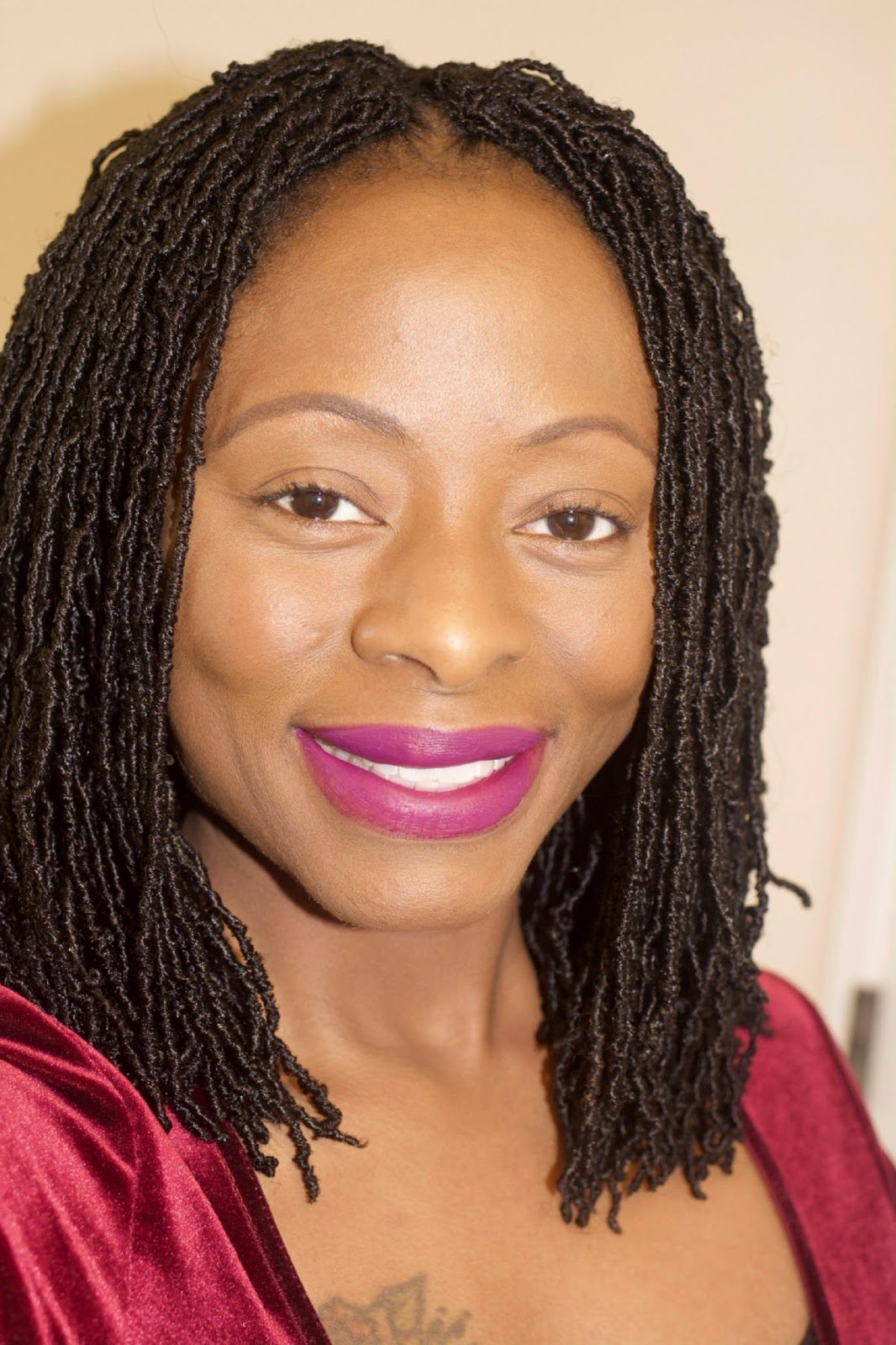 Deep Black Micro Locs at Collarbone Length