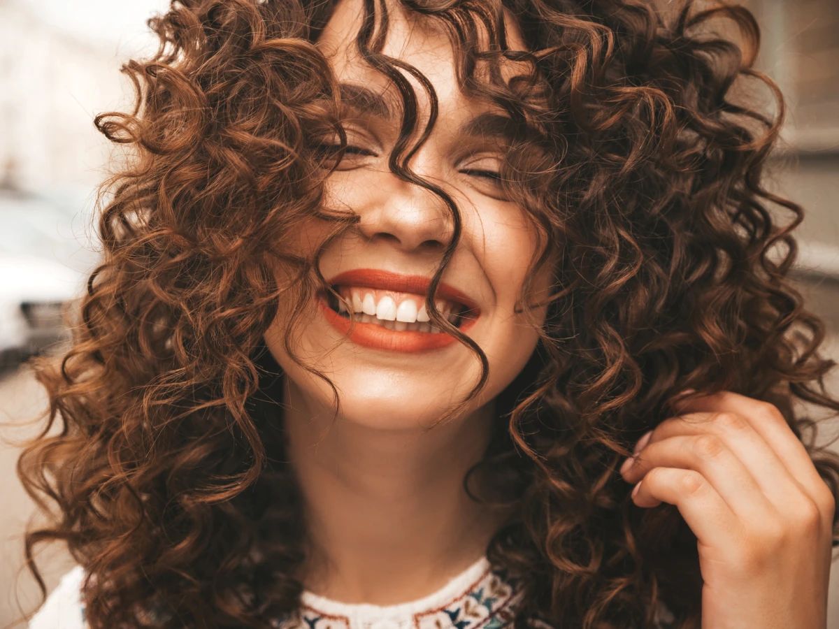Mid-Back Curls With Caramel Highlights — Perm Hairstyles