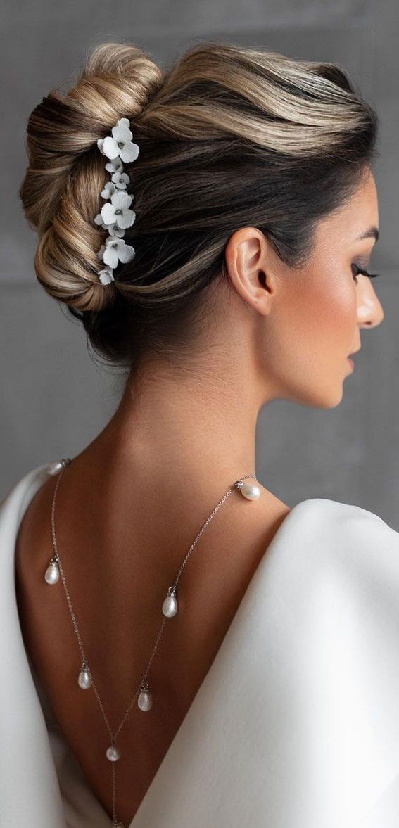 Elegant Chignon With Floral Pins Elegant Chignon With Floral Pins — Boho Wedding Hair