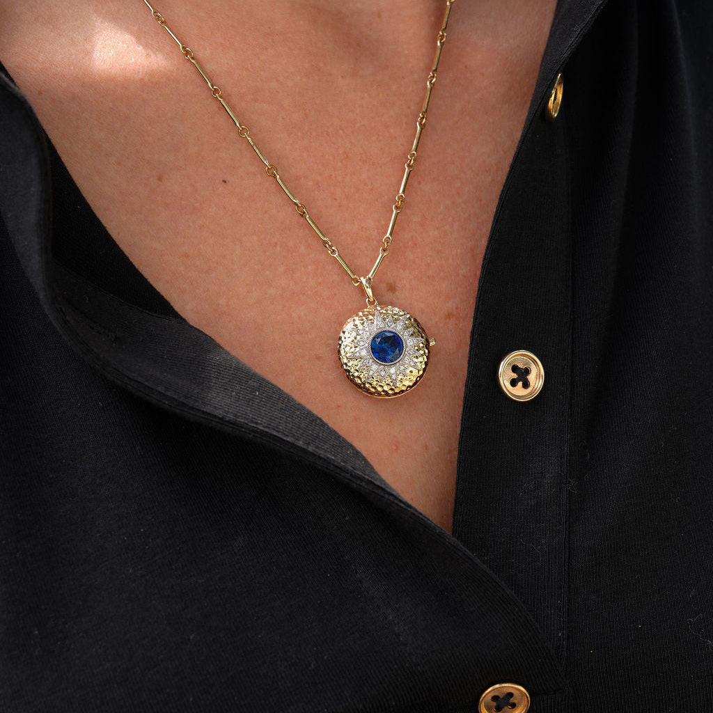 Starburst Locket with Sapphire on Black Shirt — Locket Necklaces