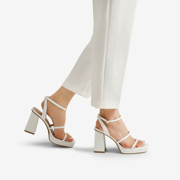 Monochromatic Summer Vibe: White Platform Heels with White Trousers Monochromatic Summer Vibe: White Platform Heels with White Trousers — Strappy Heels Outfits