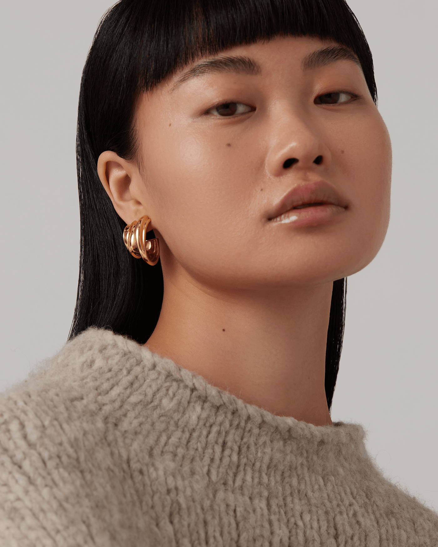 Multi-Layered Gold Hoops with Knit Sweater — Hoop Earrings
