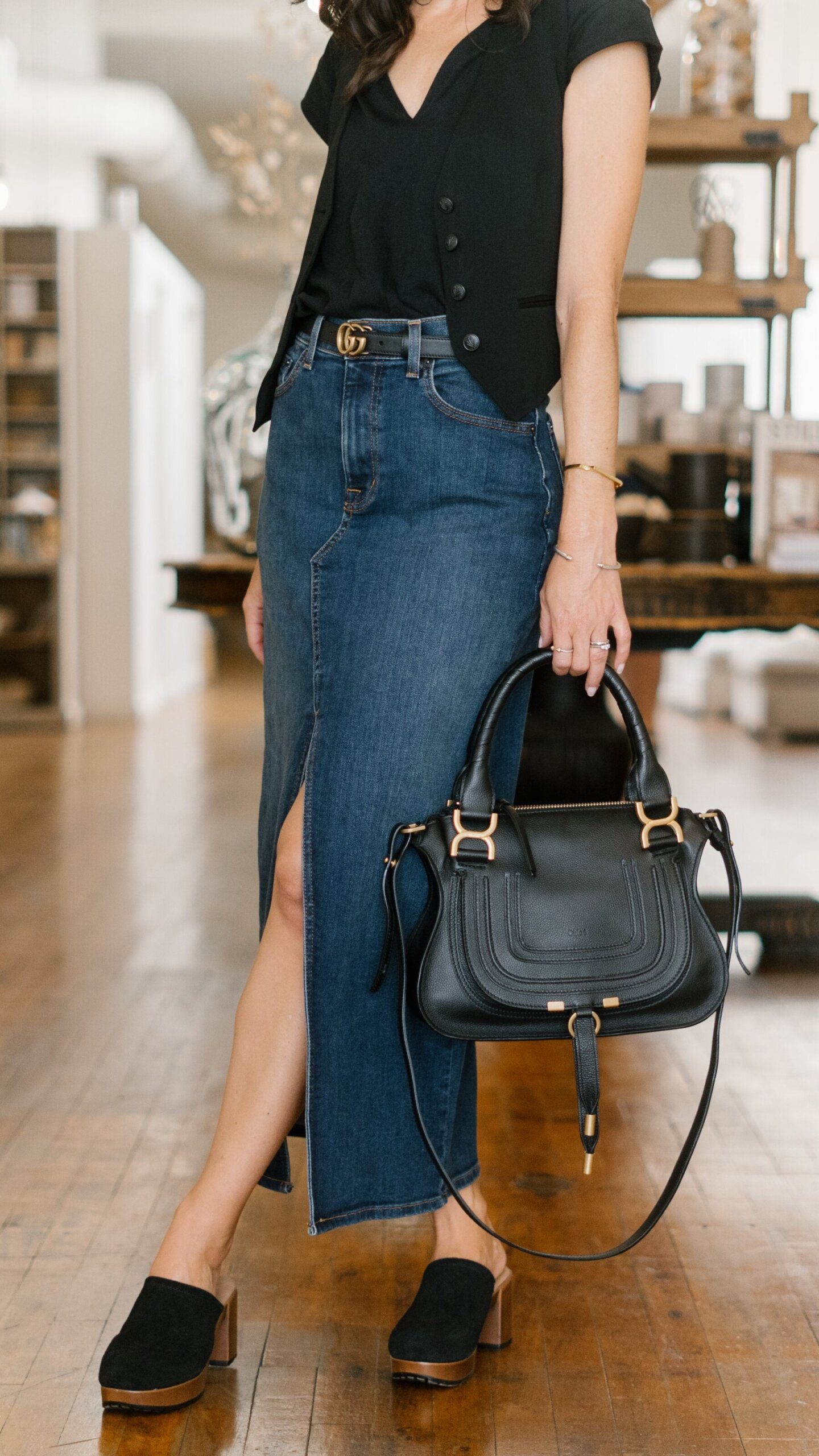 Dark Wash Maxi Skirt with Black Vest and Logo Belt — Jean Skirt Outfits