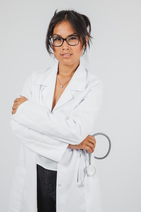 Classic White Lab Coat with Stethoscope in Hand Classic White Lab Coat with Stethoscope in Hand — Doctor Outfits Women