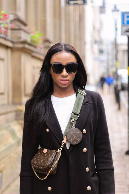 Sophisticated Layering: Black Coat and Multi Pochette Bag Sophisticated Layering: Black Coat and Multi Pochette Bag — Louis Vuitton Bag Outfits